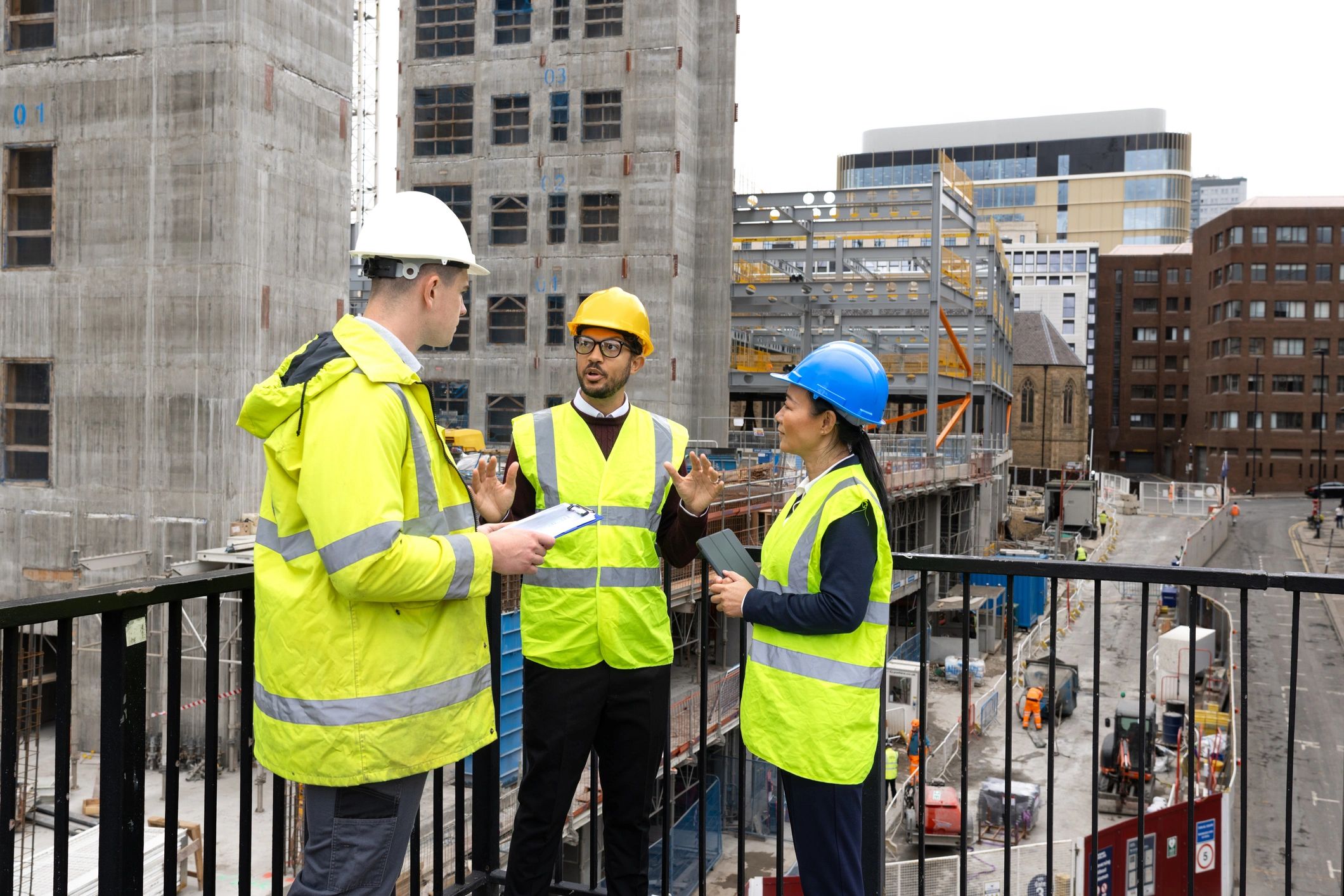 Construction professionals reviewing plans on site